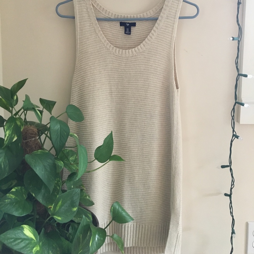 Cream-colored, knitted tank.
